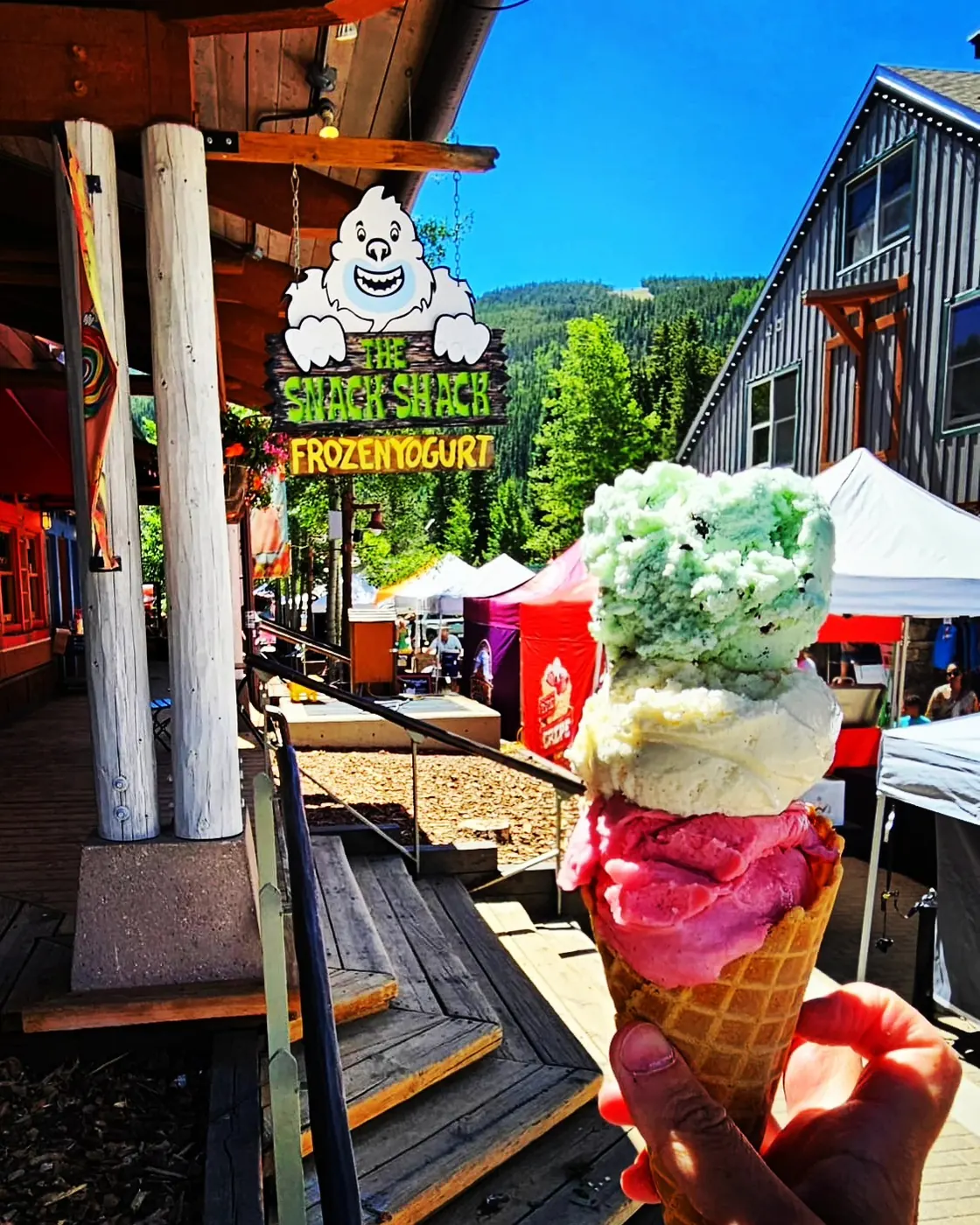 A double scoop cone from The Snack Shack held up in River Run Village during a festival